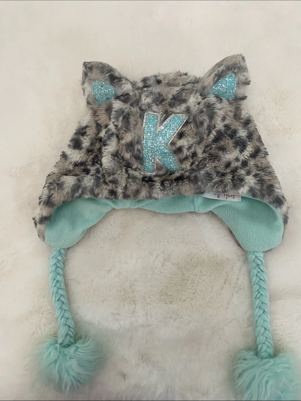 Justice Faux Fur Animal Ear Hat with Aqua Lining and Glitter 'K'